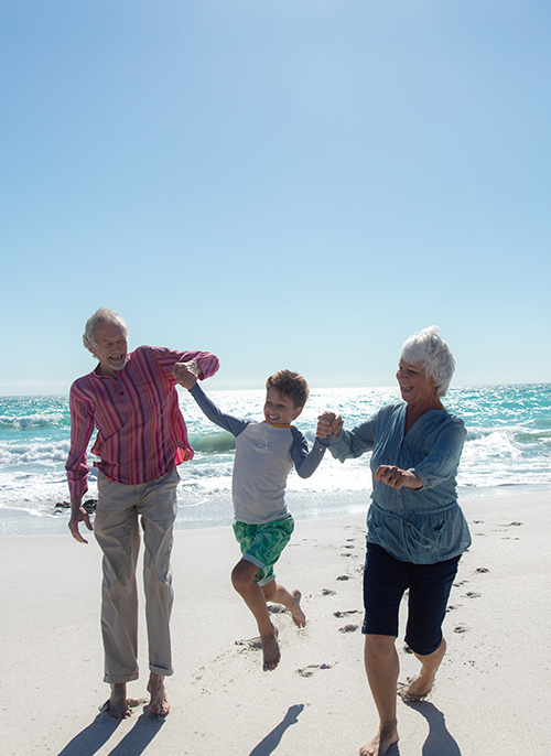 Grandparents and Grandson on Beach Are Fixed Index Annuities Good San Diego CA