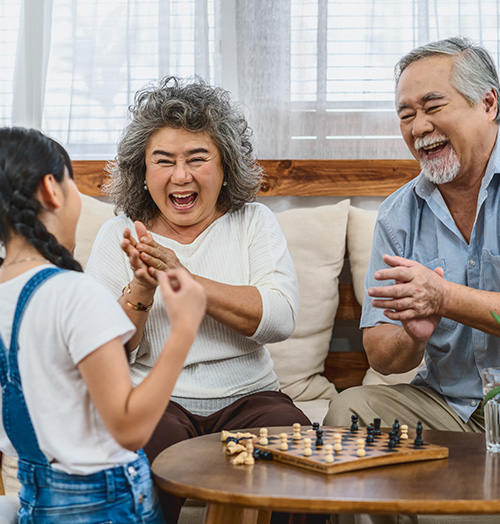 Grandparents Playing Chess with Grandchild Annuity Income